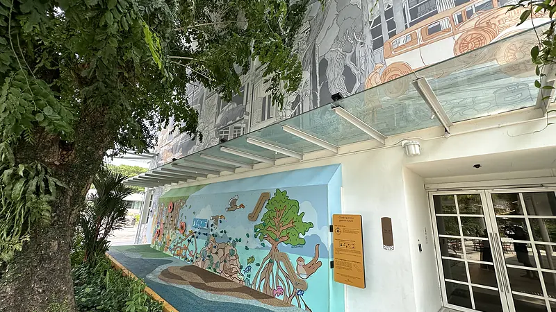 Completed Temasek Shophouse environmental playwall beside the mature tree and conserved building